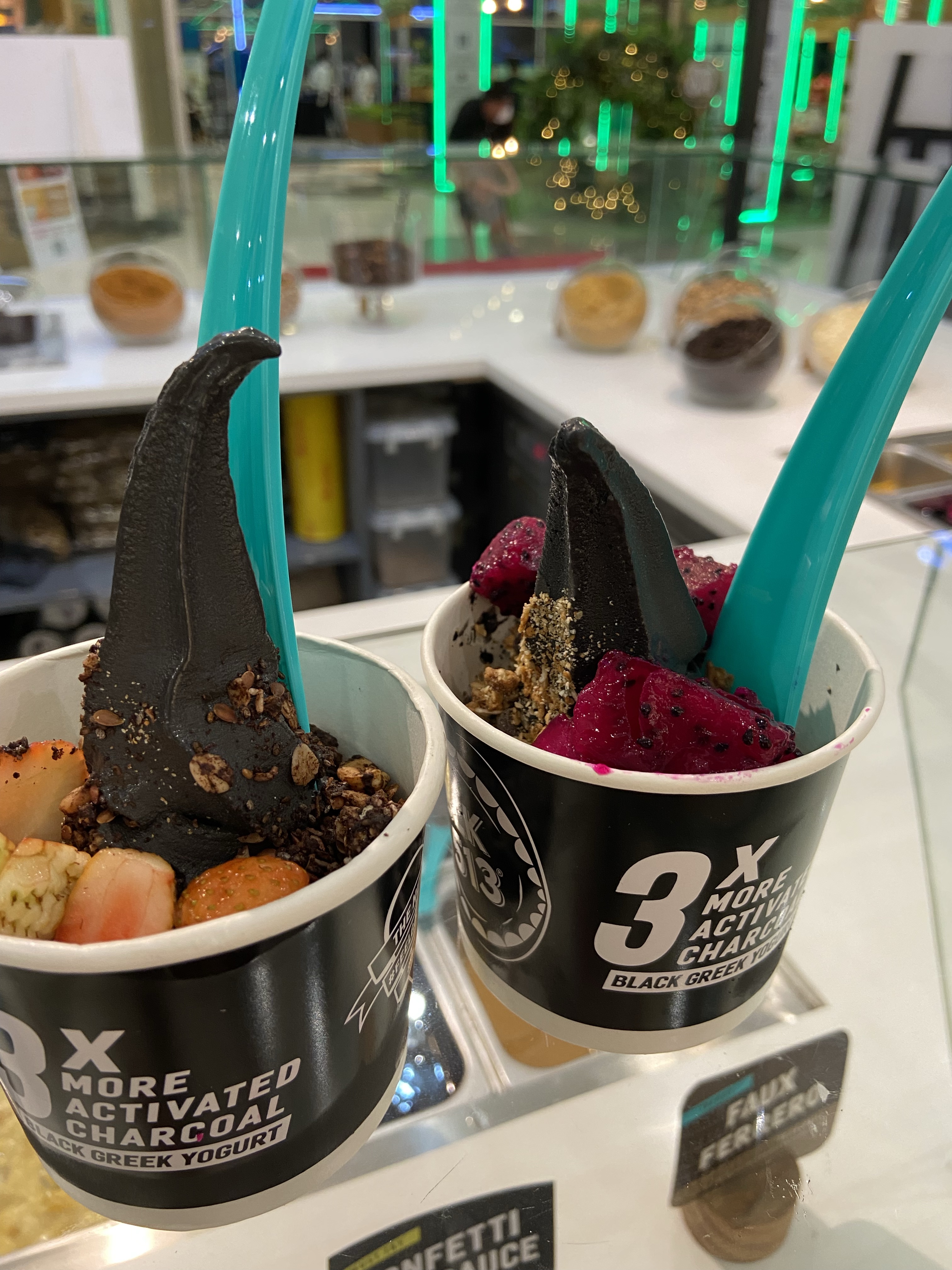 Frozen yoghurt with colourful fruit and toppings