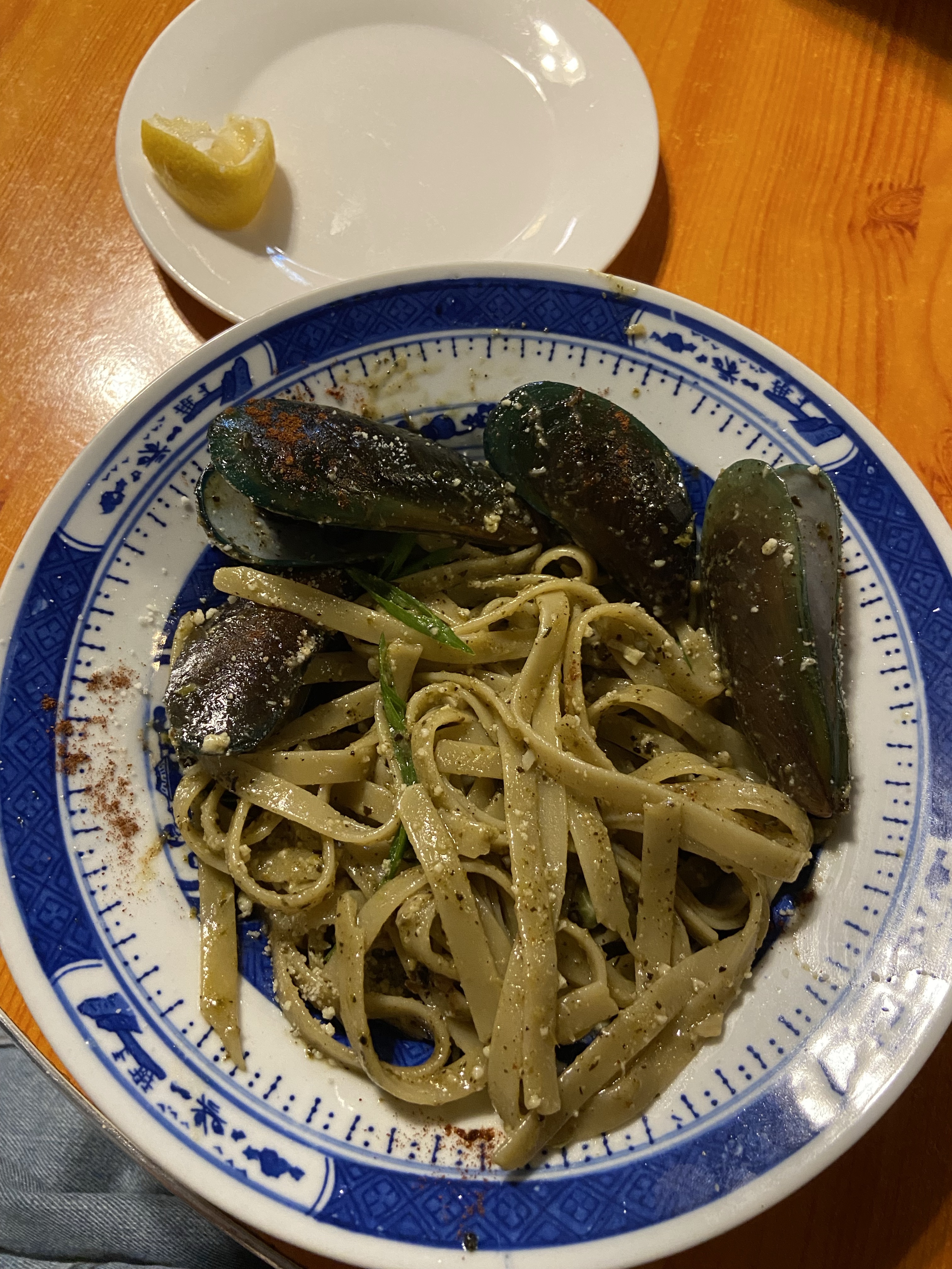 A plate of pasta with vegetables at a restaurant