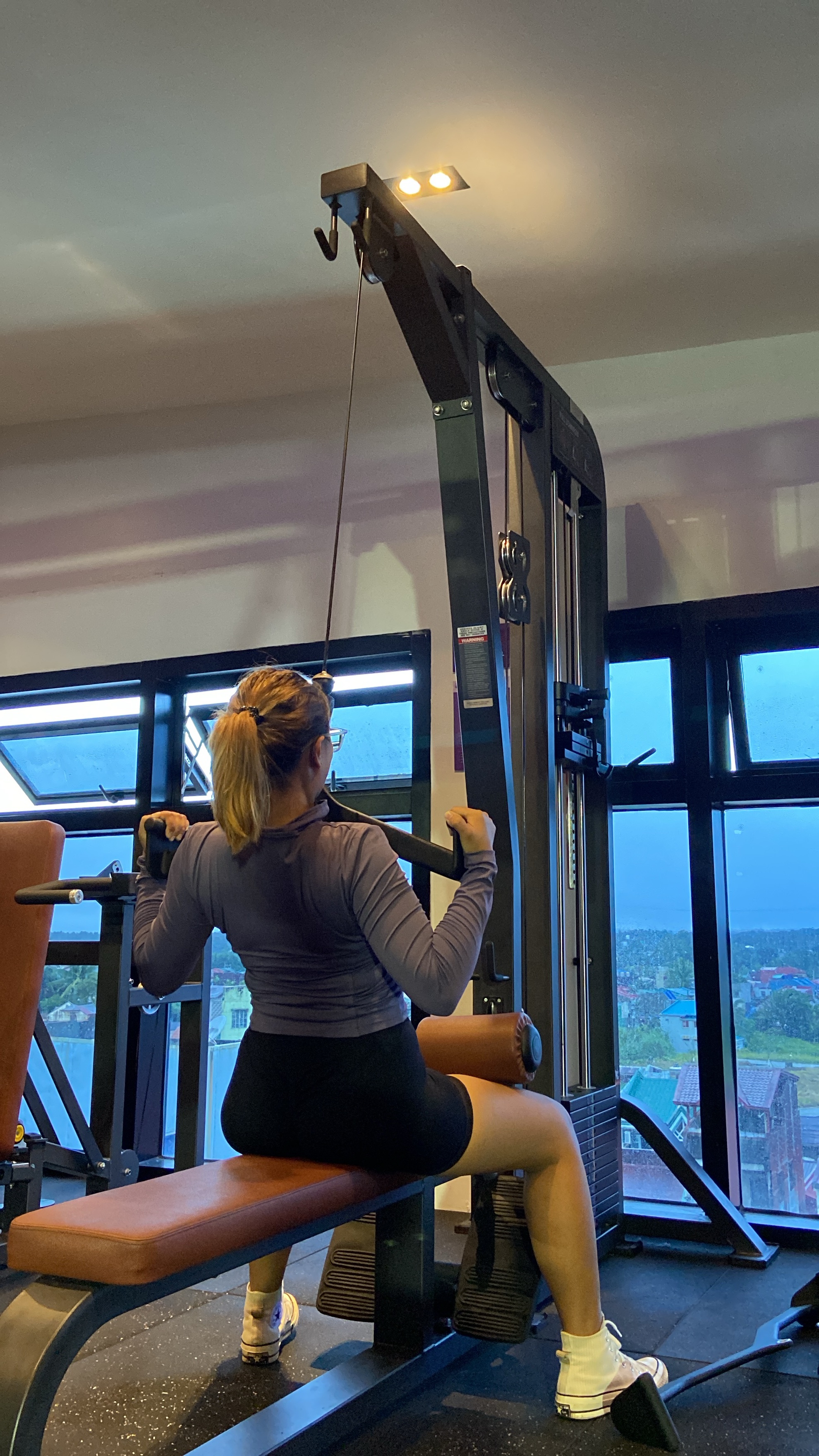 Shyla enjoying a gym workout on a cable machine